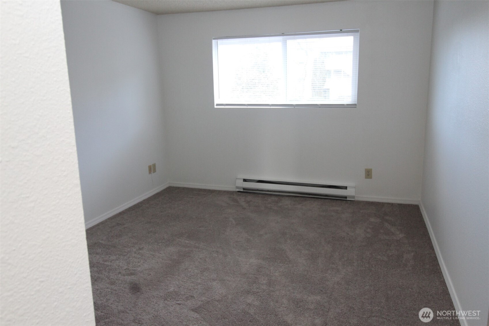 15210 Macadam Road South, Unit D304 Tukwila, WA 98188 - Photo 11 of 23 an empty room with a window