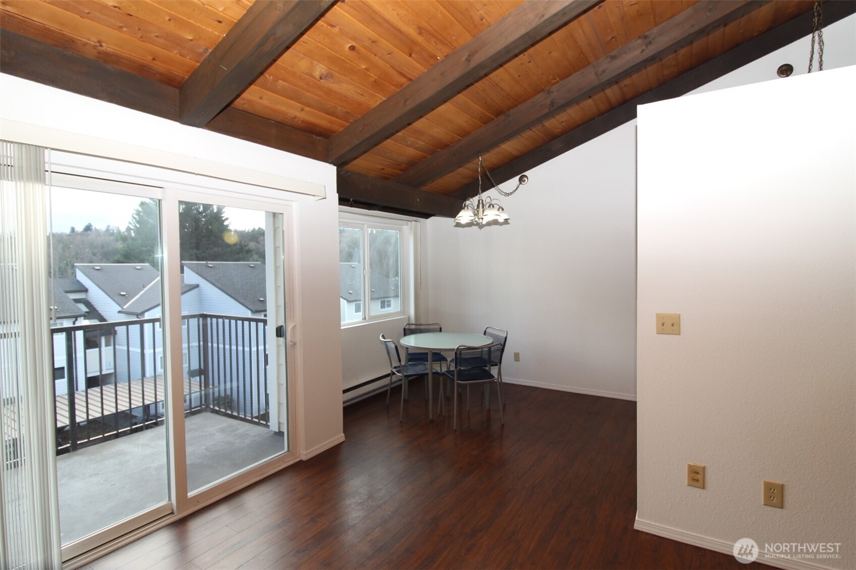 15210 Macadam Road South, Unit D304 Tukwila, WA 98188 - Photo 2 of 23 a view of a hallway with wooden floor and furniture
