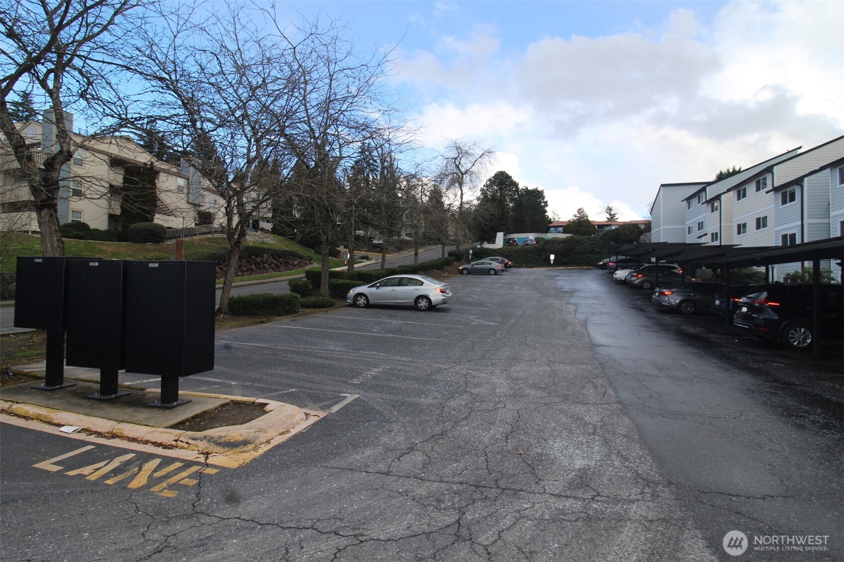 15210 Macadam Road South, Unit D304 Tukwila, WA 98188 - Photo 23 of 23 a view of a street with cars parked on the road