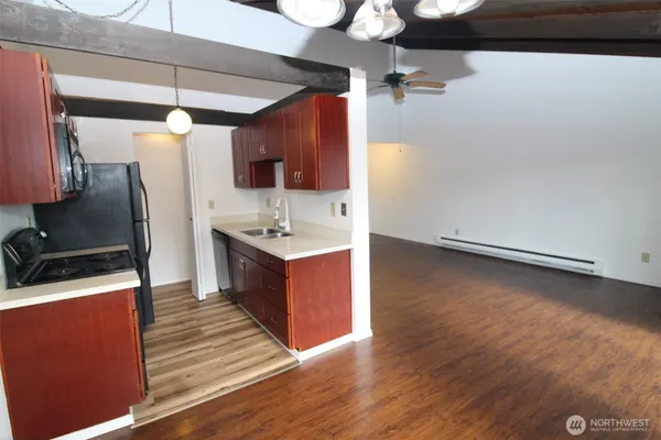 an empty room with wooden floor