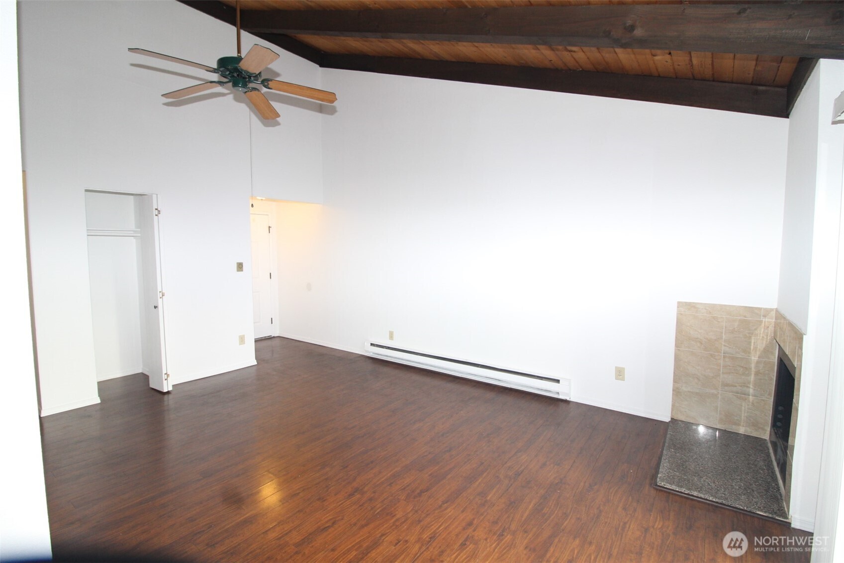 15210 Macadam Road South, Unit D304 Tukwila, WA 98188 - Photo 5 of 23 an empty room with wooden floor