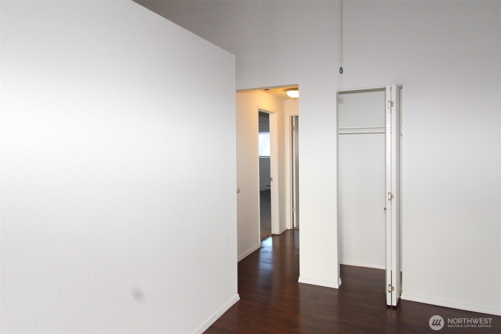 15210 Macadam Road South, Unit D304 Tukwila, WA 98188 - Photo 6 of 23 a view of a hallway with wooden floor