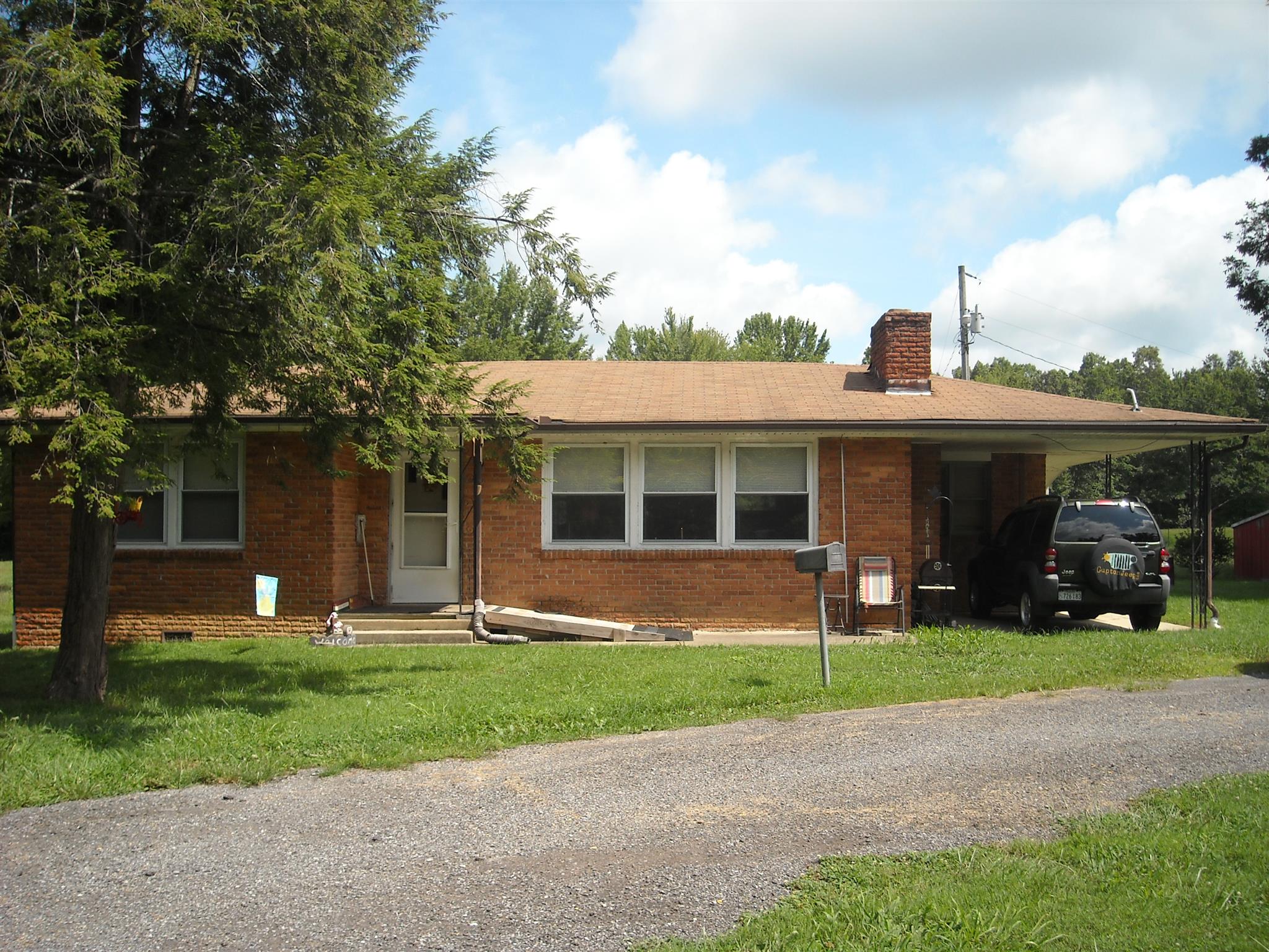 2152 Chambliss Road Pleasant View, TN 37146 - Photo 1 of 24 a view of a house with a yard and tree s