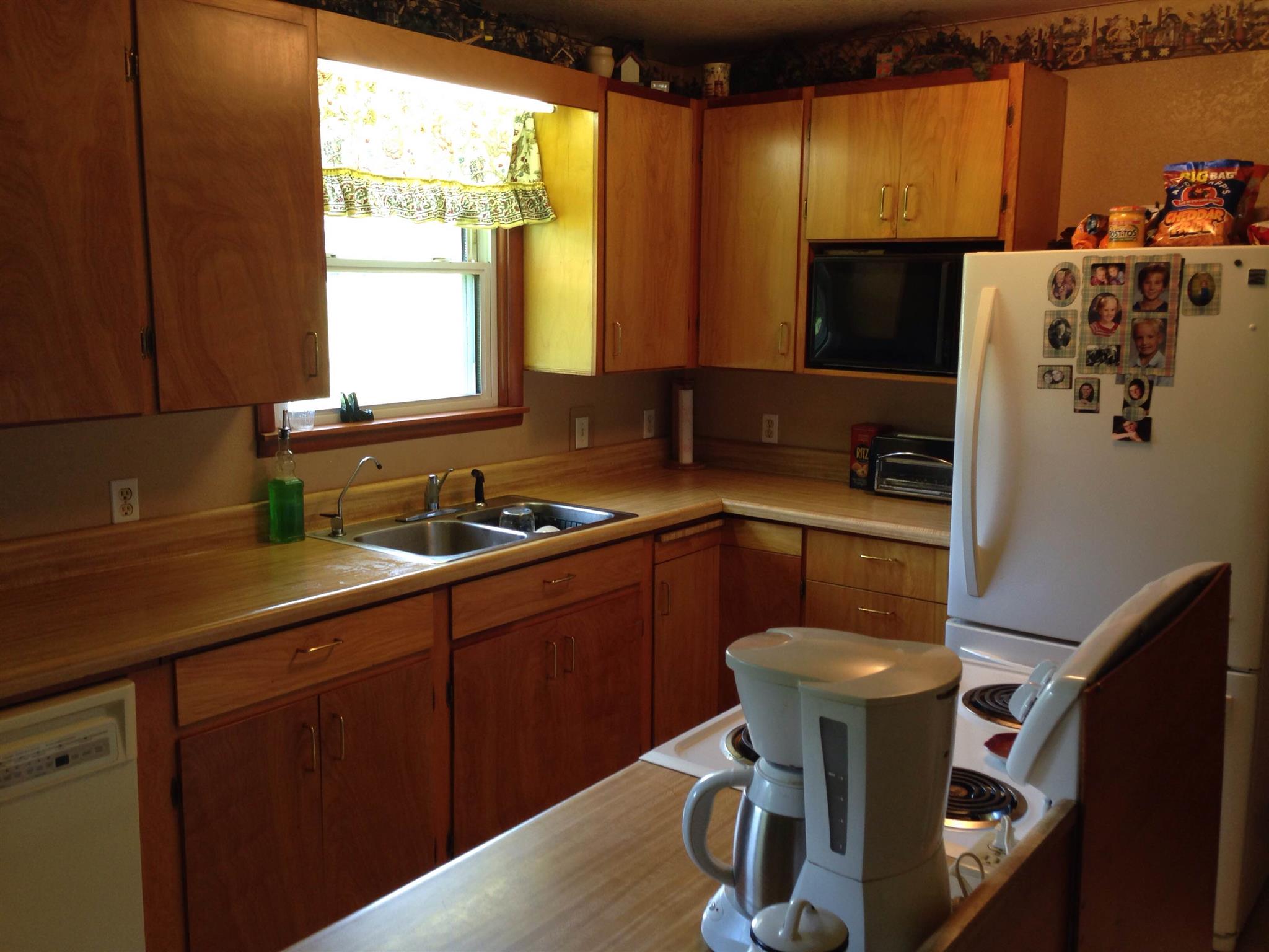 2152 Chambliss Road Pleasant View, TN 37146 - Photo 12 of 24 a kitchen with a sink cabinets and window