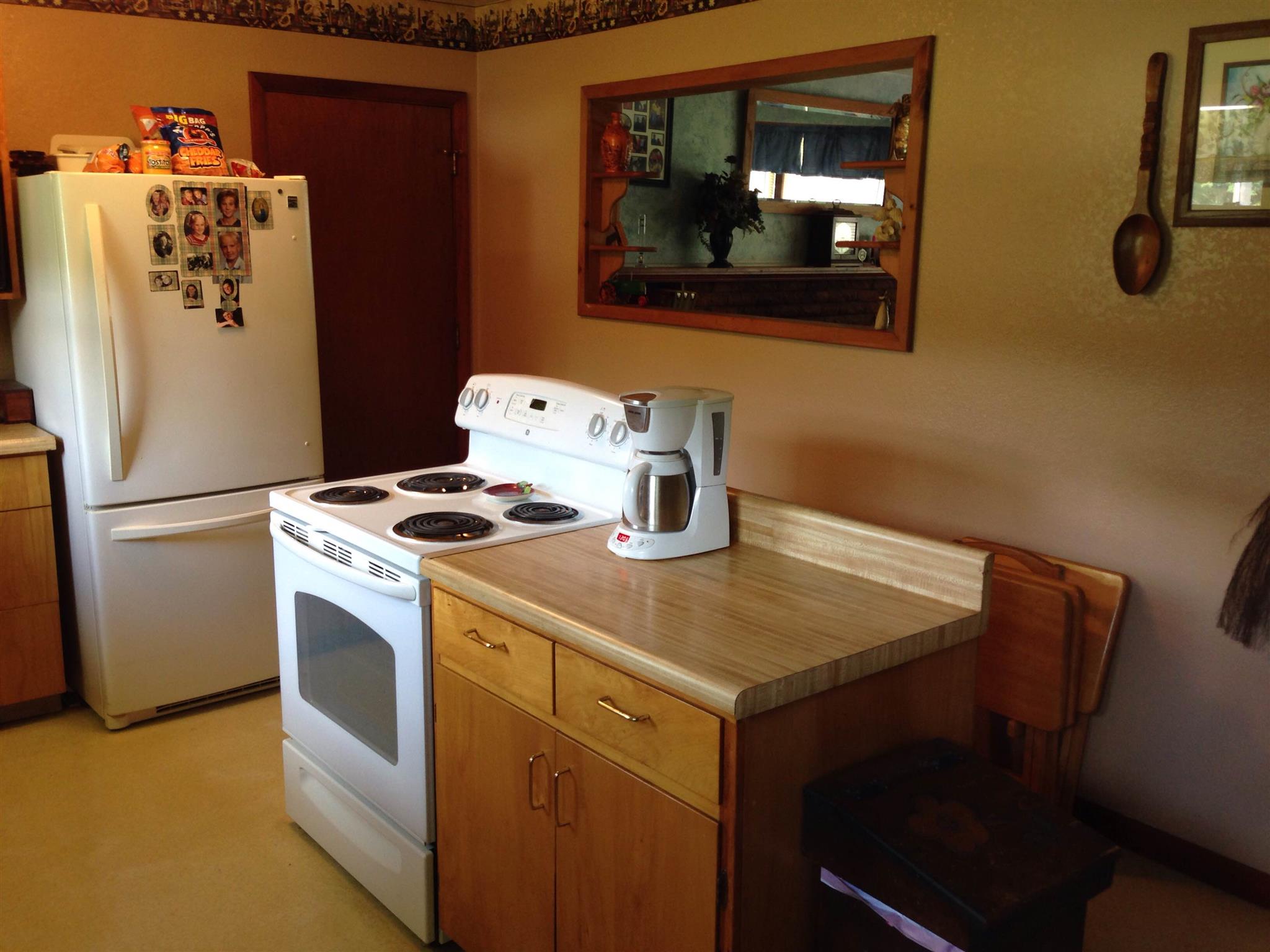 2152 Chambliss Road Pleasant View, TN 37146 - Photo 13 of 24 a kitchen with a refrigerator and a stove