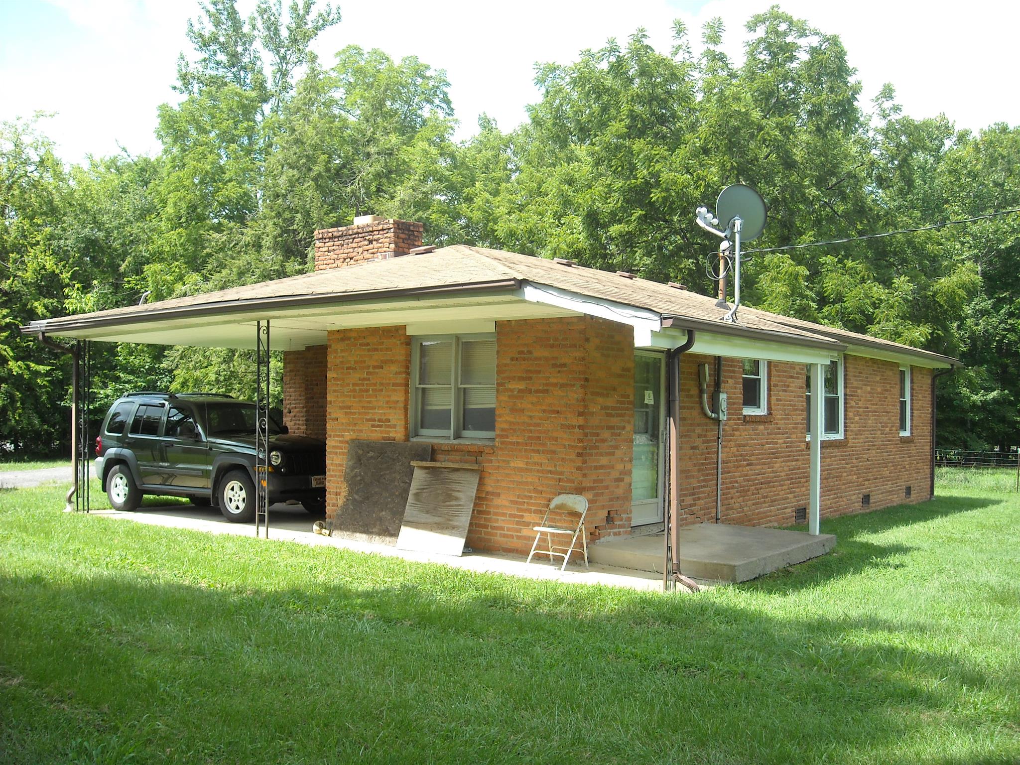 2152 Chambliss Road Pleasant View, TN 37146 - Photo 15 of 24 a backyard of a house with table and chairs