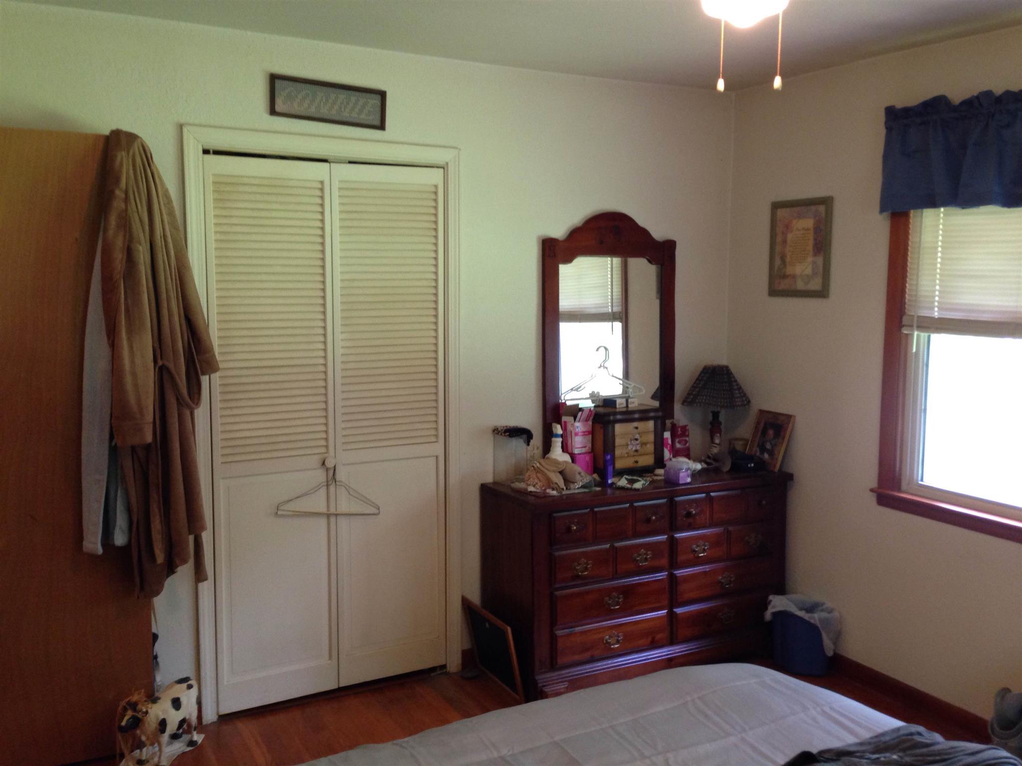 2152 Chambliss Road Pleasant View, TN 37146 - Photo 5 of 24 a bedroom with a bed and a mirror on the dresser