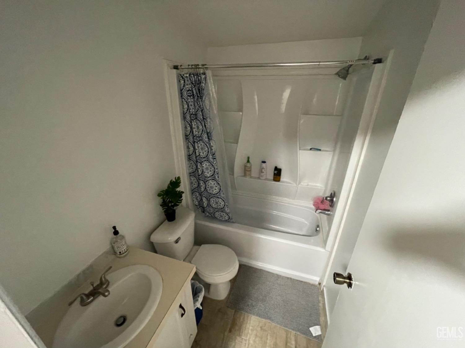 Undisclosed Address Bakersfield, CA 93304 - Photo 16 of 24 a bathroom with a sink toilet and shower