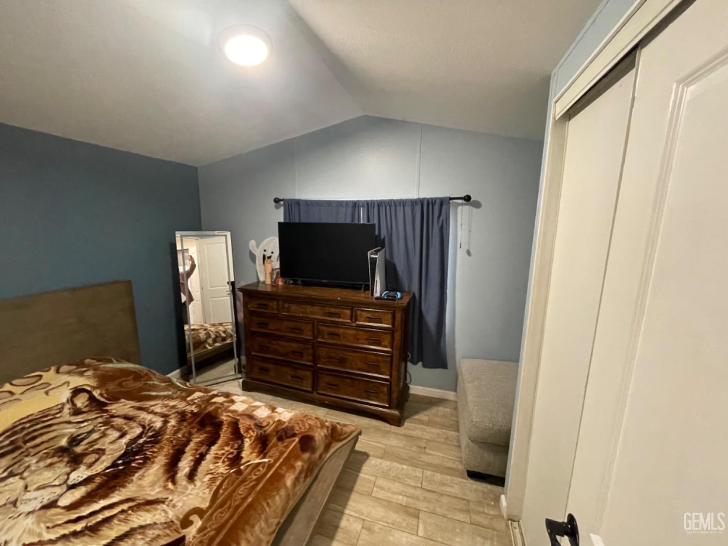 Undisclosed Address Bakersfield, CA 93304 - Photo 17 of 24 a bedroom with a bed and flat screen tv