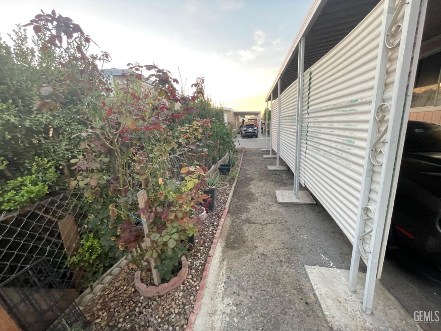 Undisclosed Address Bakersfield, CA 93304 - Photo 19 of 24 a view of a pathway of a house with backyard