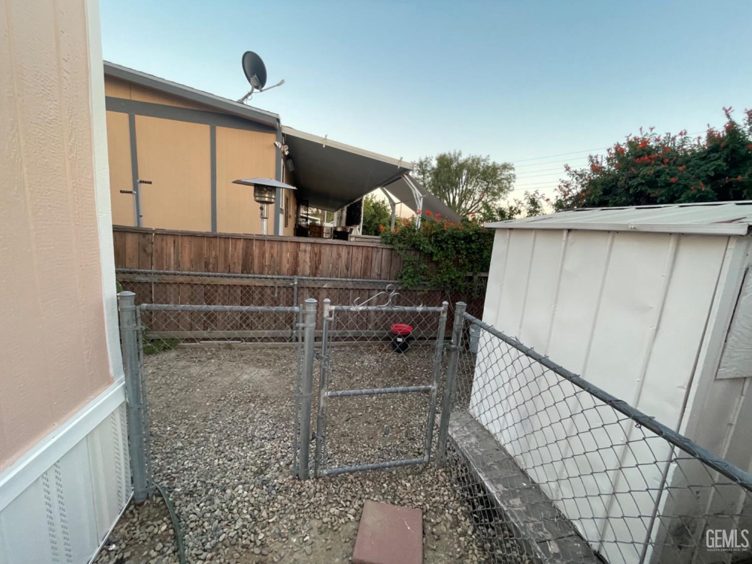 Undisclosed Address Bakersfield, CA 93304 - Photo 21 of 24 a bathroom with mirror and shower
