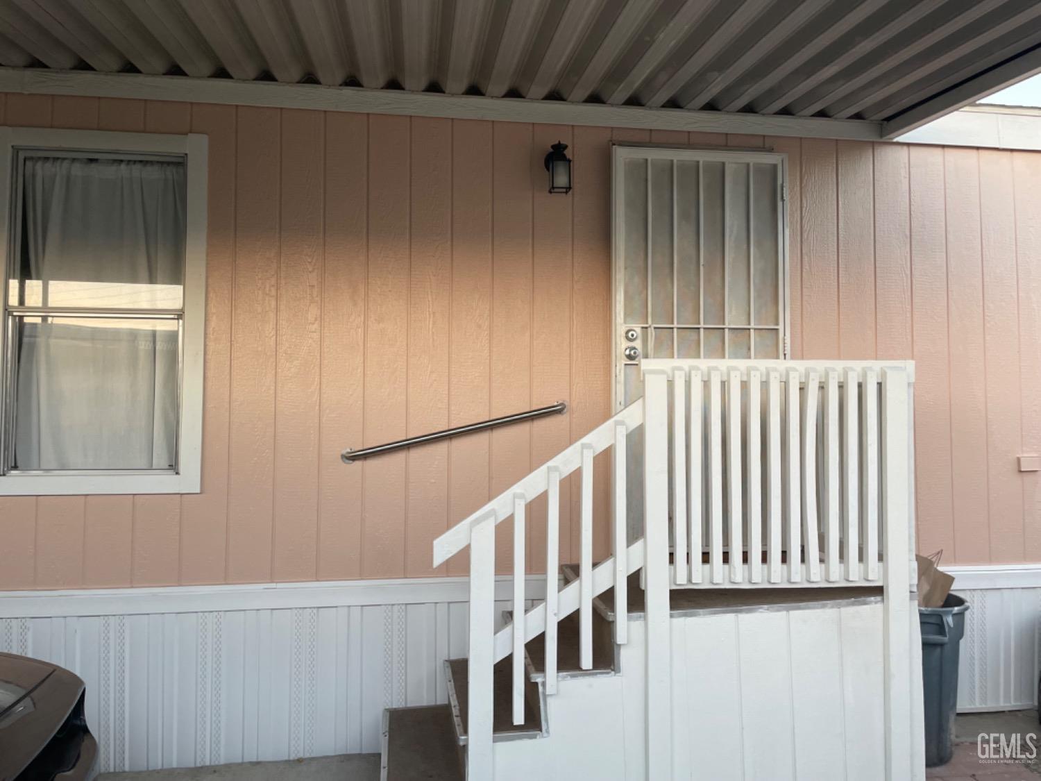 Undisclosed Address Bakersfield, CA 93304 - Photo 4 of 24 a view of staircase with white walls and stairs