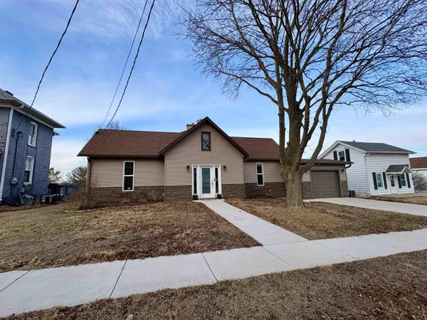 a front view of a house with yard
