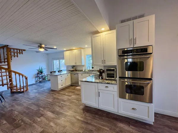 a kitchen with counter top space cabinets and stainless steel appliances