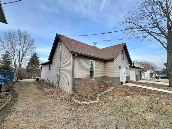 a front view of house with a yard