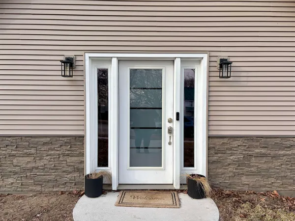 a view of a brick house with a large windows