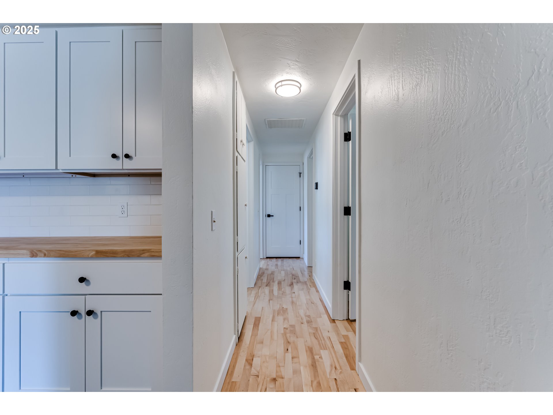 395 Fairway Loop Eugene, OR 97401 - Photo 11 of 37 a view of an empty room with wooden floor