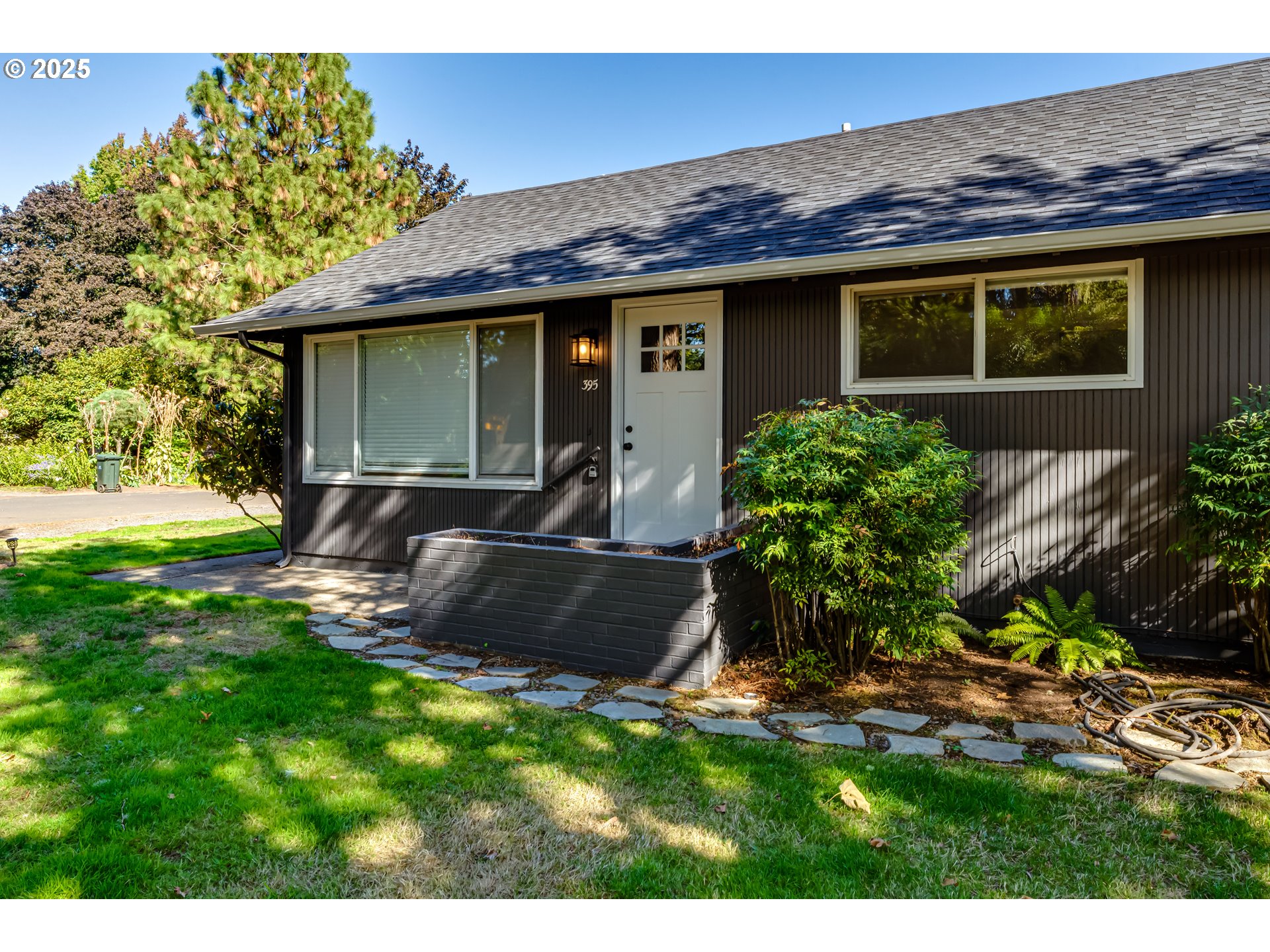 395 Fairway Loop Eugene, OR 97401 - Photo 2 of 37 a view of a house with a yard and sitting area