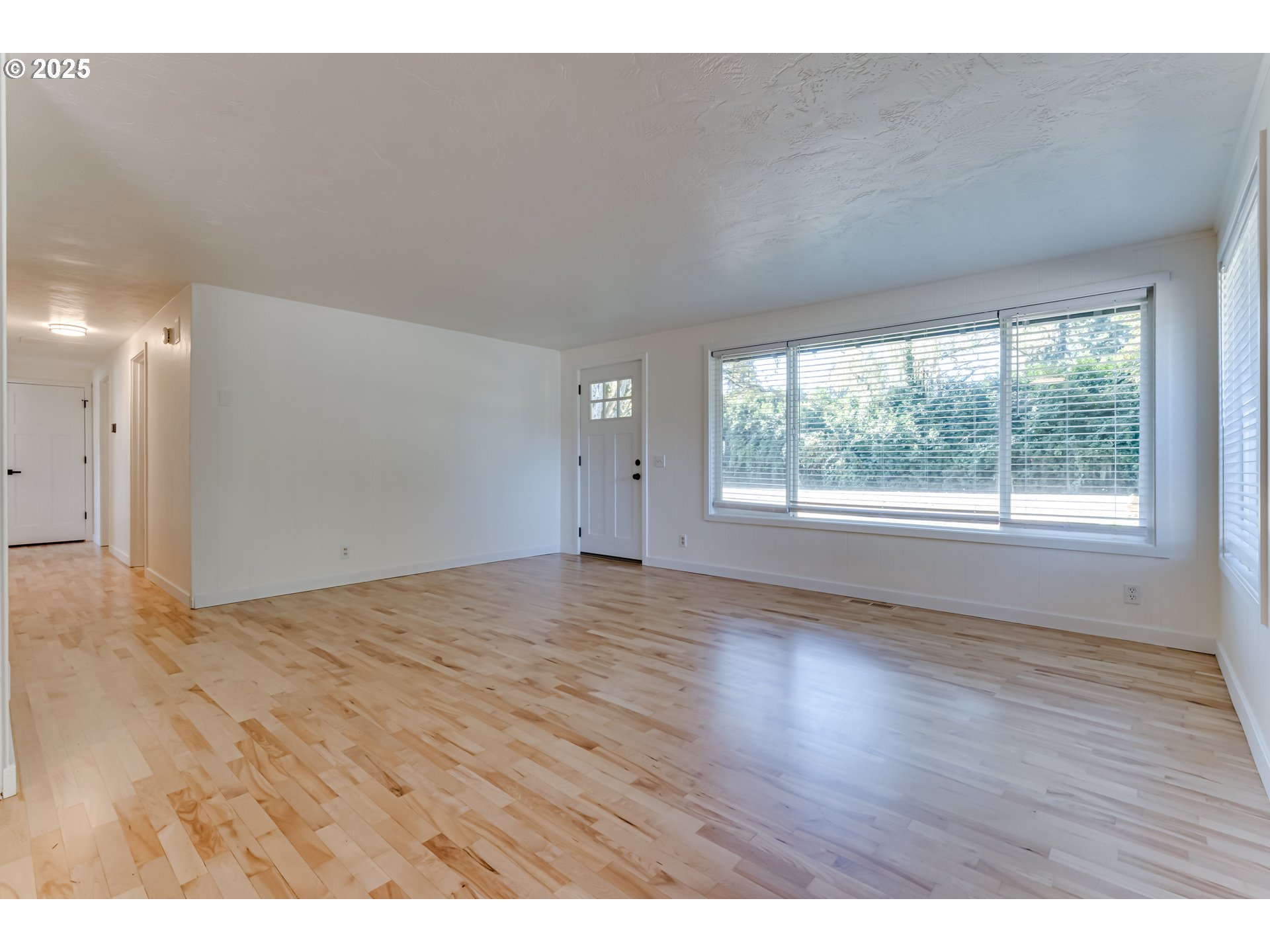 395 Fairway Loop Eugene, OR 97401 - Photo 29 of 37 a view of an empty room with wooden floor and a window