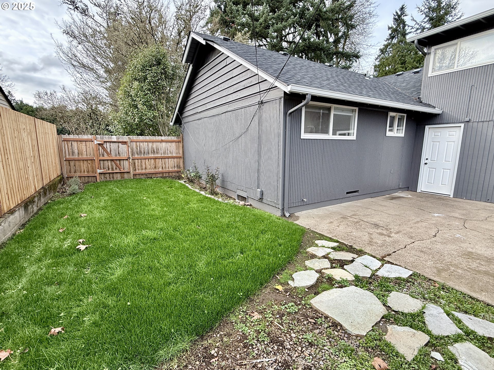 395 Fairway Loop Eugene, OR 97401 - Photo 36 of 37 a view of a backyard with wooden fence