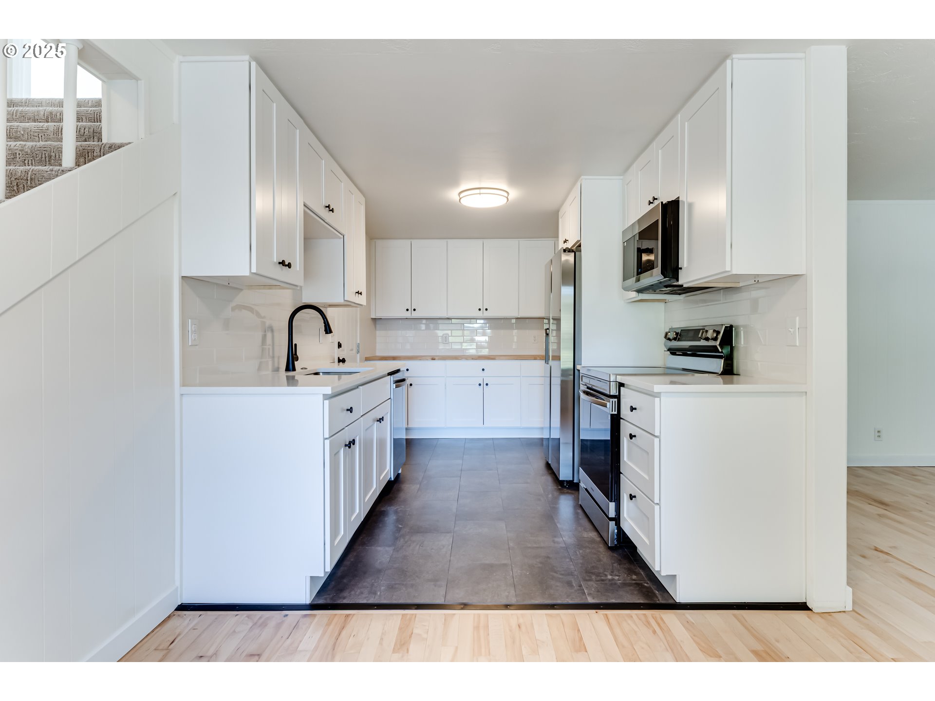 395 Fairway Loop Eugene, OR 97401 - Photo 6 of 37 a kitchen with kitchen island sink stove and refrigerator