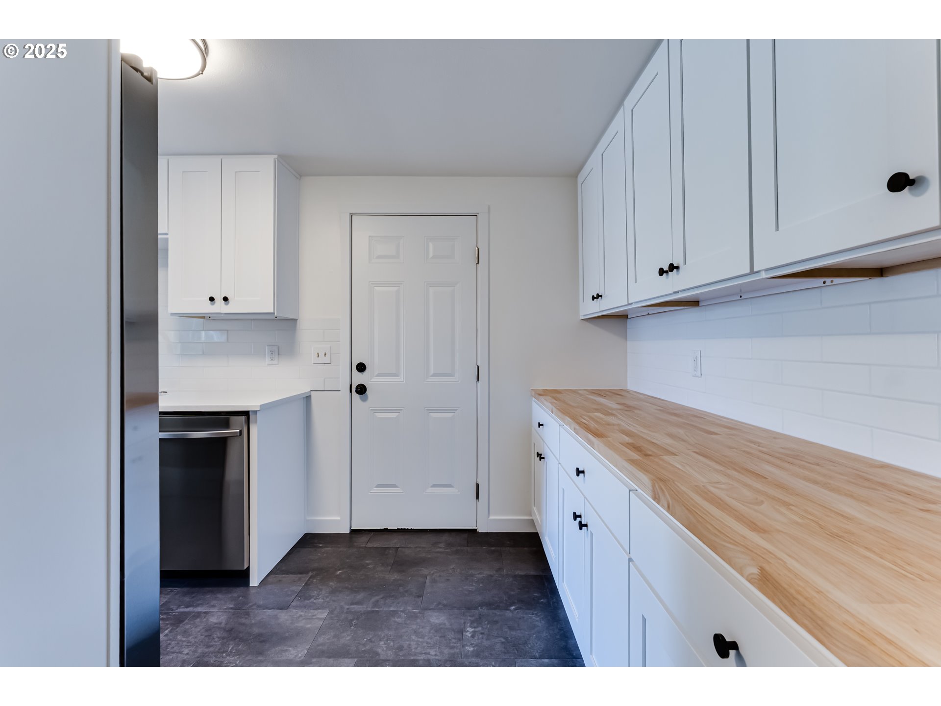 395 Fairway Loop Eugene, OR 97401 - Photo 10 of 37 a kitchen view with stainless steel appliances white cabinets and a refrigerator