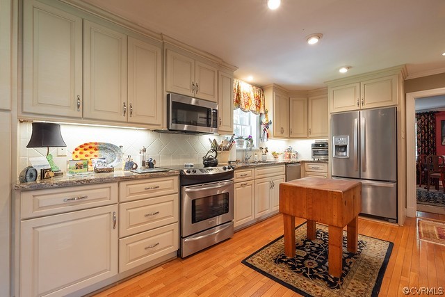 7720 Kenmore Circle Richmond, VA 23225 - Photo 11 of 48 a kitchen with granite countertop a refrigerator stove top oven and sink