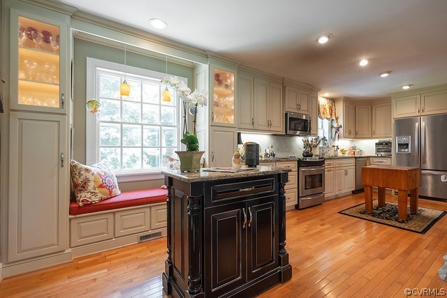 7720 Kenmore Circle Richmond, VA 23225 - Photo 12 of 48 a kitchen with granite countertop a stove a sink and a refrigerator