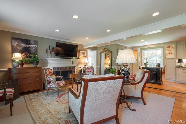 7720 Kenmore Circle Richmond, VA 23225 - Photo 14 of 48 a living room with furniture a flat screen tv and a fireplace