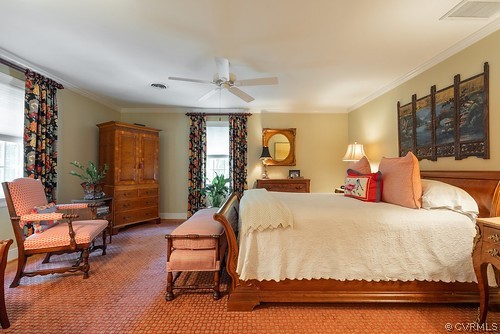 7720 Kenmore Circle Richmond, VA 23225 - Photo 23 of 48 a bedroom with a bed and large windows