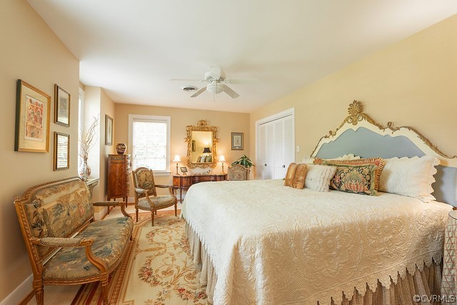 7720 Kenmore Circle Richmond, VA 23225 - Photo 28 of 48 a bedroom with a bed and wooden floor