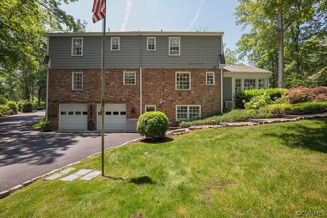 7720 Kenmore Circle Richmond, VA 23225 - Photo 39 of 48 a front view of a house with garden