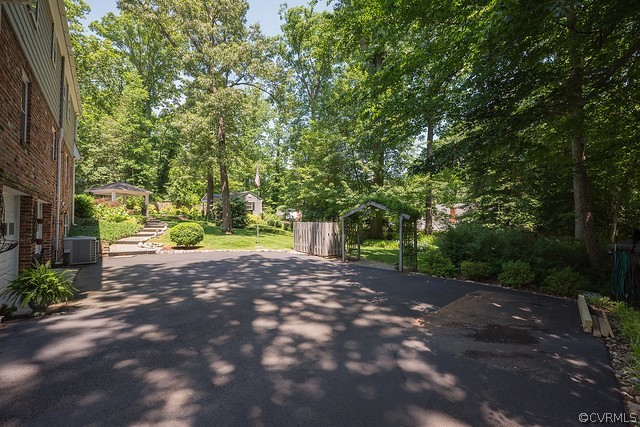 7720 Kenmore Circle Richmond, VA 23225 - Photo 40 of 48 a view of a yard with plants and trees