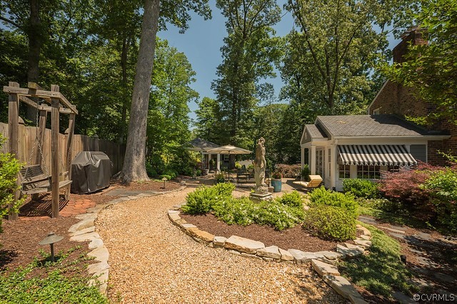 7720 Kenmore Circle Richmond, VA 23225 - Photo 43 of 48 a view of a chair and table in backyard of the house