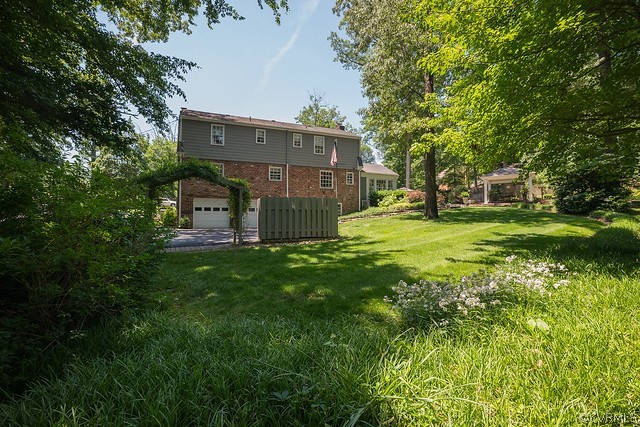 7720 Kenmore Circle Richmond, VA 23225 - Photo 47 of 48 a view of a house with backyard and a tree