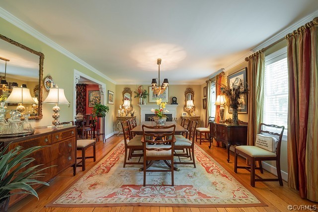 7720 Kenmore Circle Richmond, VA 23225 - Photo 9 of 48 a living room with furniture and a chandelier