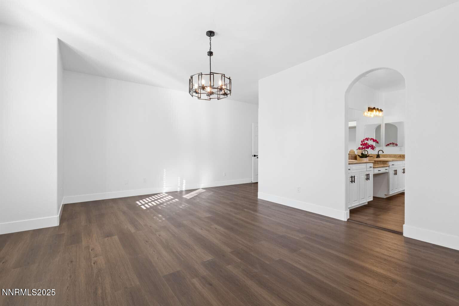 11020 Colton Drive Reno, NV 89521 - Photo 12 of 30 a view of an empty room with wooden floor and a window