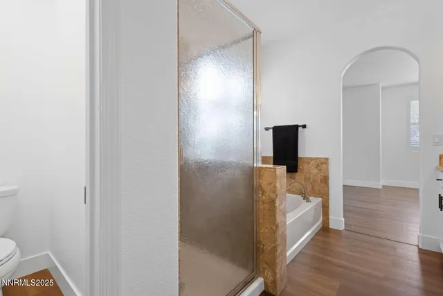 a view of a bathroom from a hallway