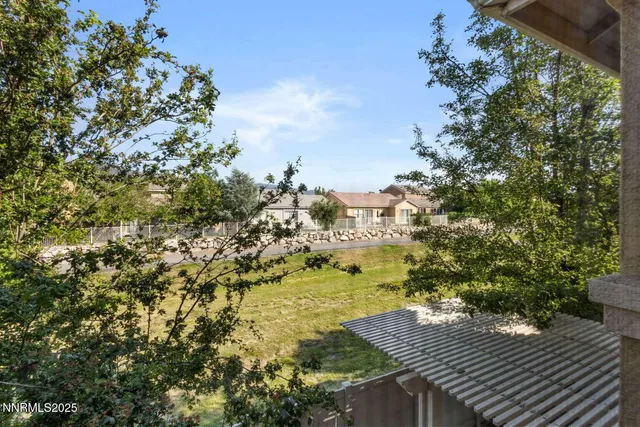 a view of a balcony with wooden floor