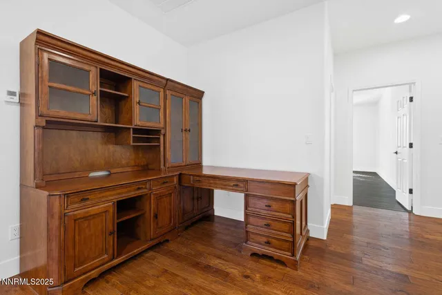 a kitchen with wooden cabinets and a stove top oven