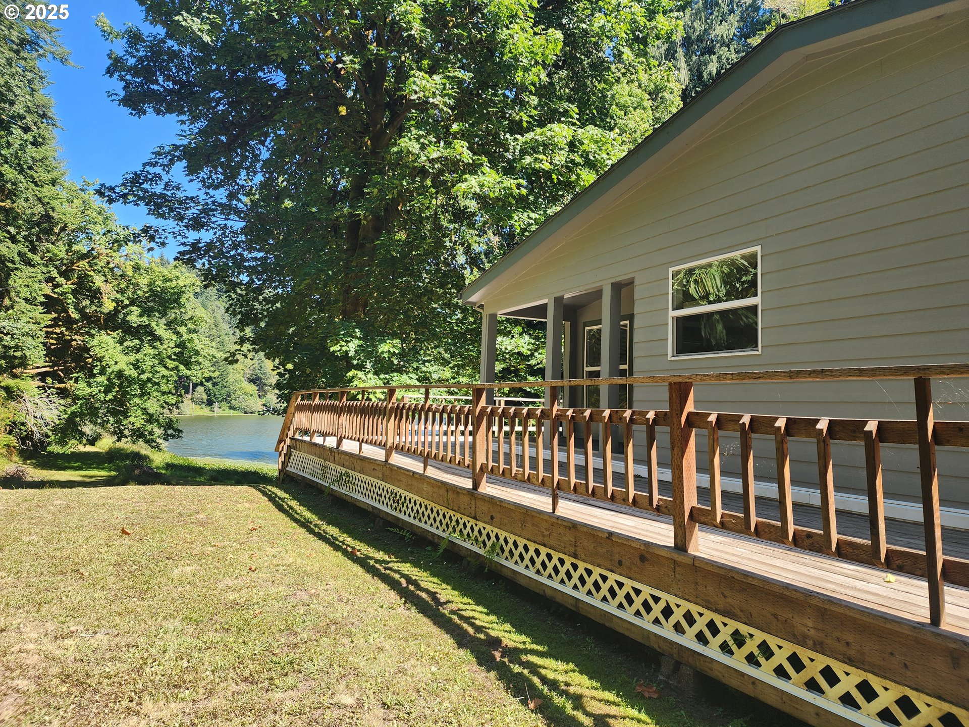 2647 South Tenmile Lakeside, OR 97449 - Photo 1 of 47 a view of a house with a balcony
