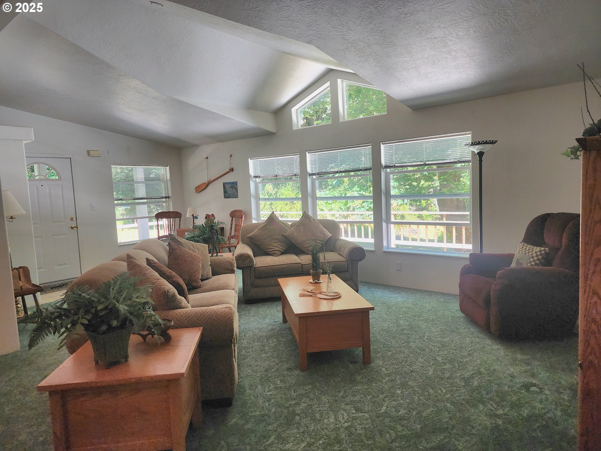 2647 South Tenmile Lakeside, OR 97449 - Photo 14 of 47 a living room with furniture and a large window