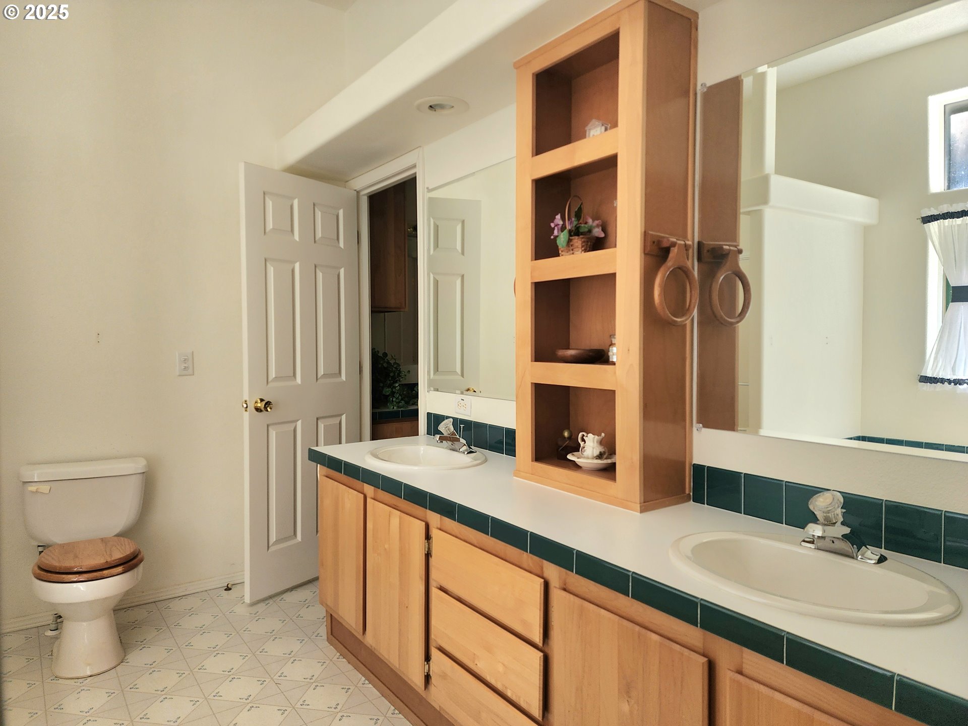2647 South Tenmile Lakeside, OR 97449 - Photo 26 of 47 a spacious bathroom with a granite countertop sink and a mirror