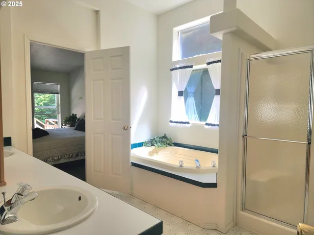 a bathroom with a bathtub and a sink