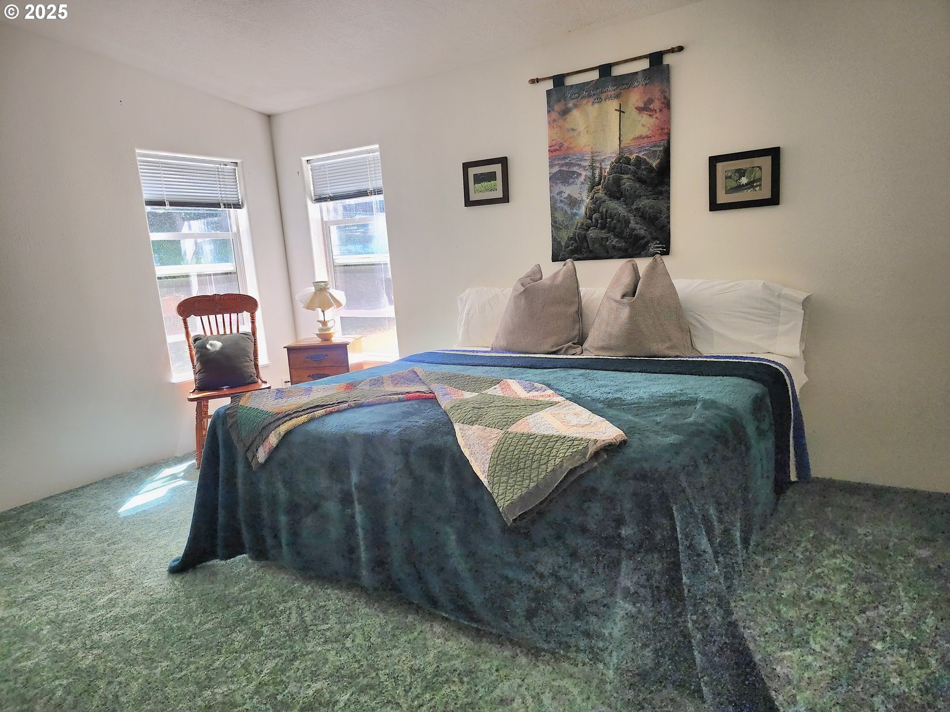 2647 South Tenmile Lakeside, OR 97449 - Photo 28 of 47 a bedroom with a bed and wooden floor