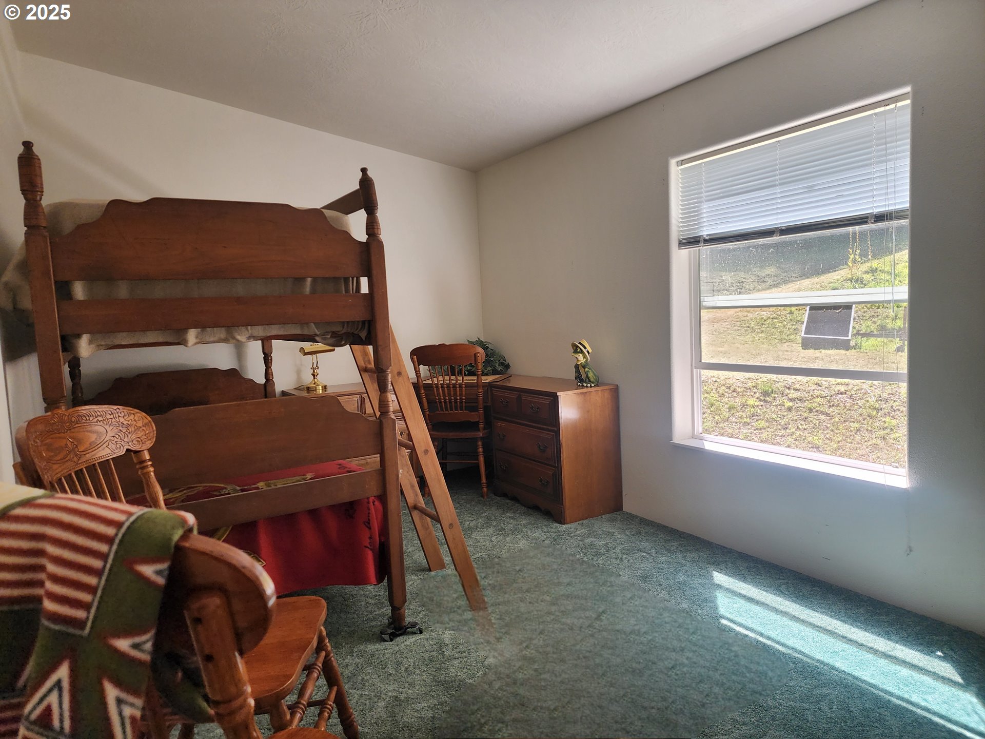 2647 South Tenmile Lakeside, OR 97449 - Photo 29 of 47 a room with furniture and a window