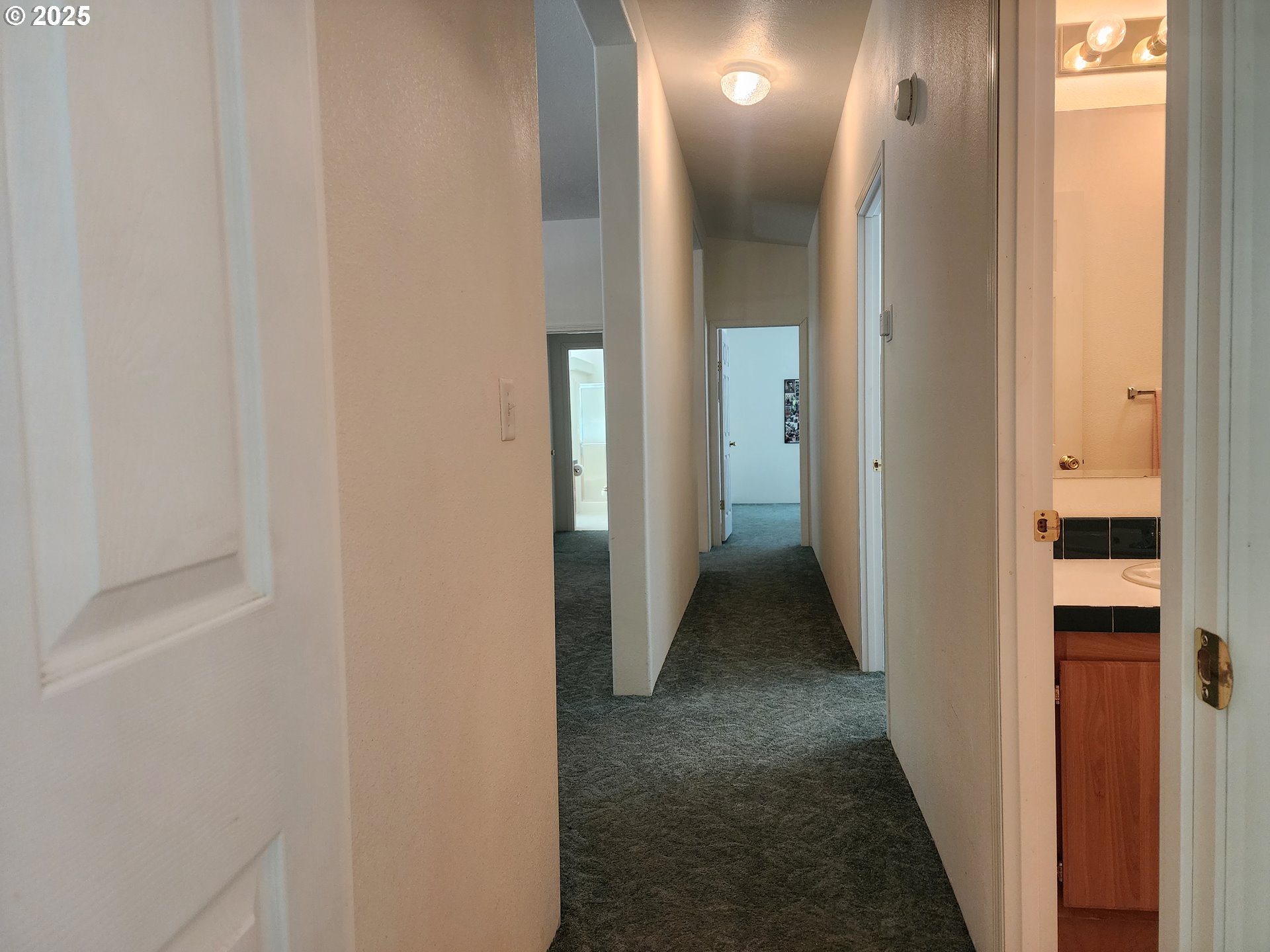 2647 South Tenmile Lakeside, OR 97449 - Photo 34 of 47 a view of a hallway with wooden floor