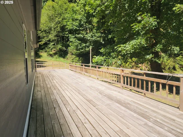 a view of a balcony with wooden floor