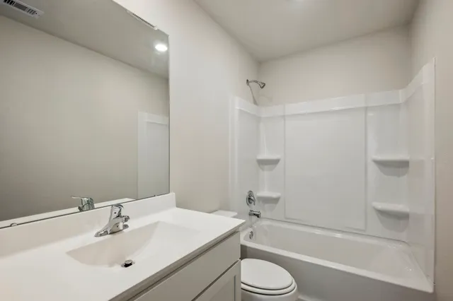 a bathroom with a sink toilet a bathtub and shower