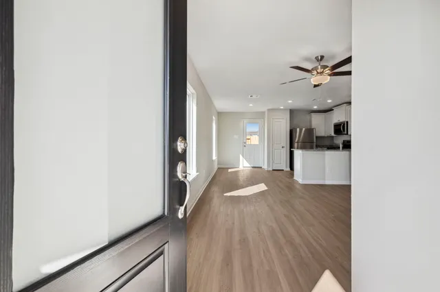 a view of a kitchen from the hallway